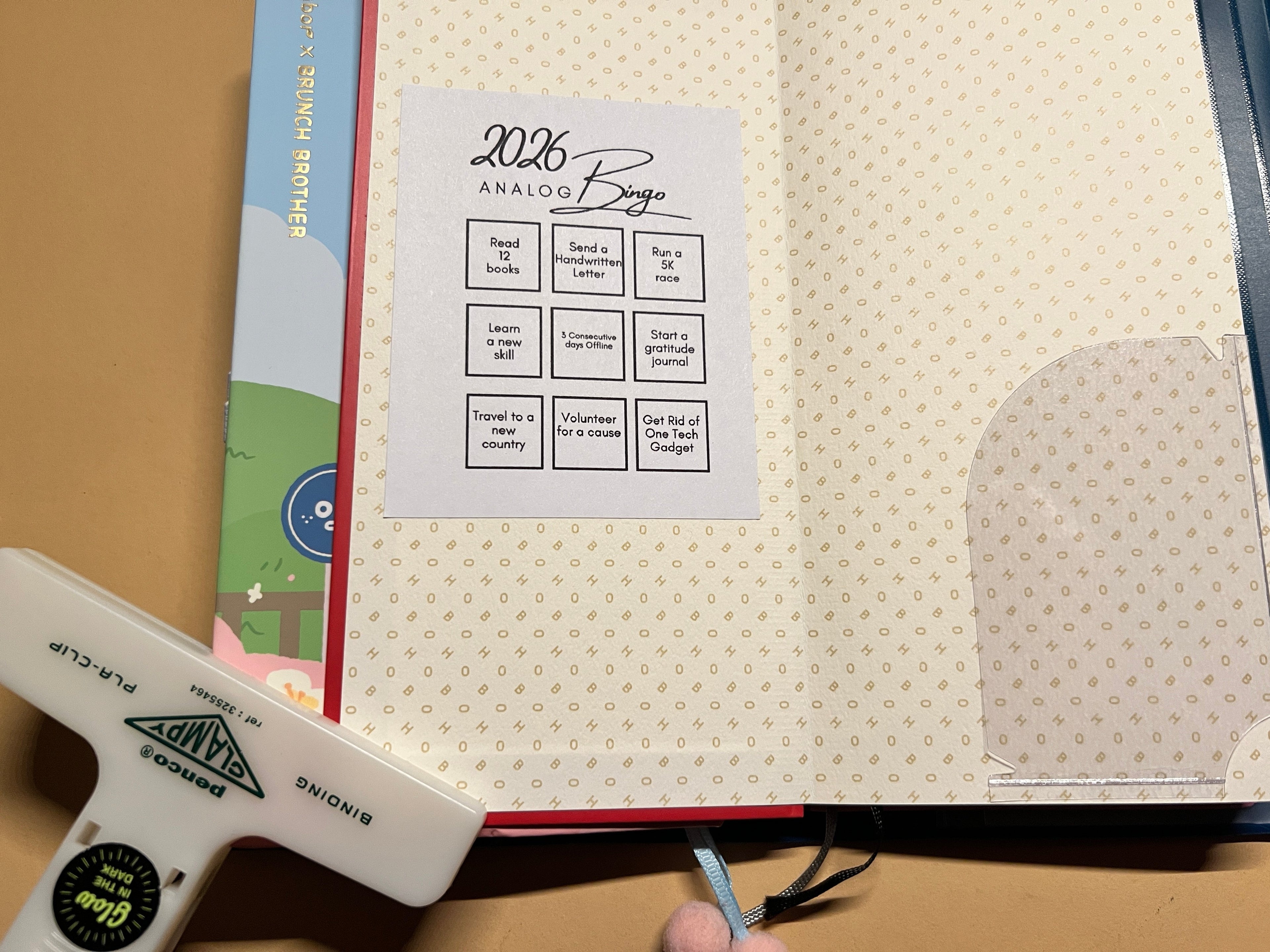 Sheet of stickers with text and graphics on a textured surface with a light box.